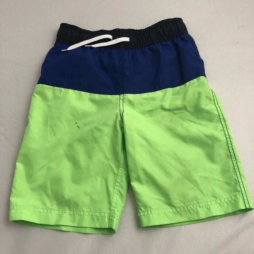 The Children’s Place blue and neon green swim trunks